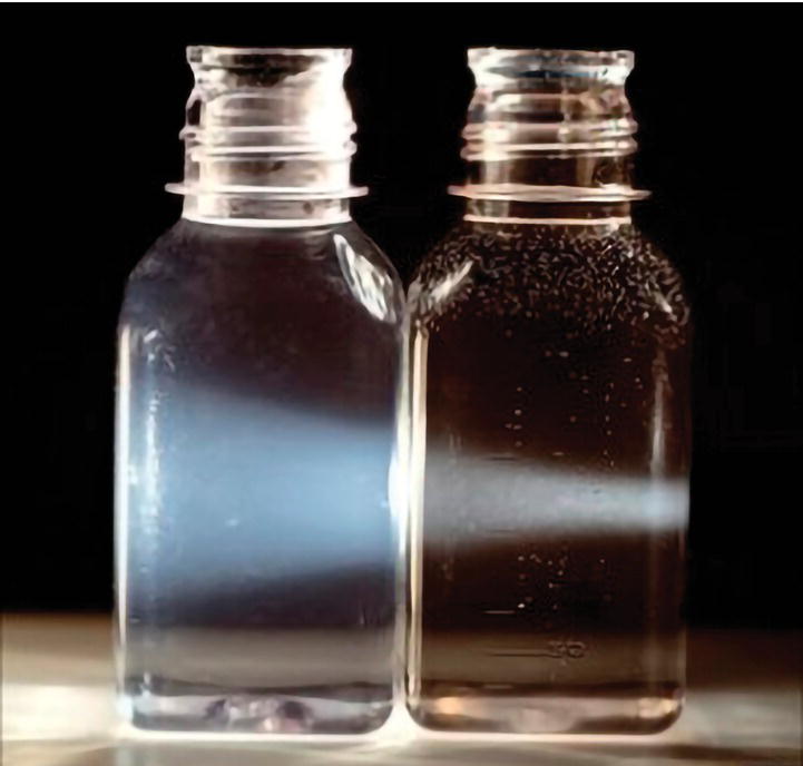 Photo displaying 2 transparent glass bottles with light passing through, depicting Tyndall effect.