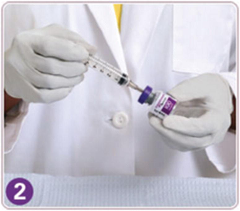 Photo displaying a hand directing a syringe to a vial.