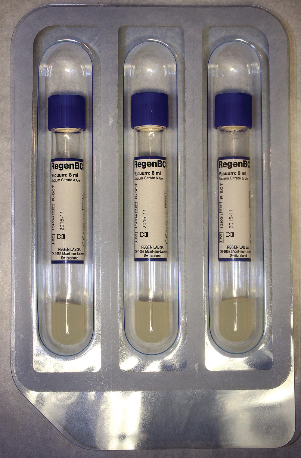 Schematic illustration of platelet-rich plasma kit from Regen Lab containing three vacuum tubes, using a thixotropic gel for cell separation and sodium citrate as an anticoagulant.